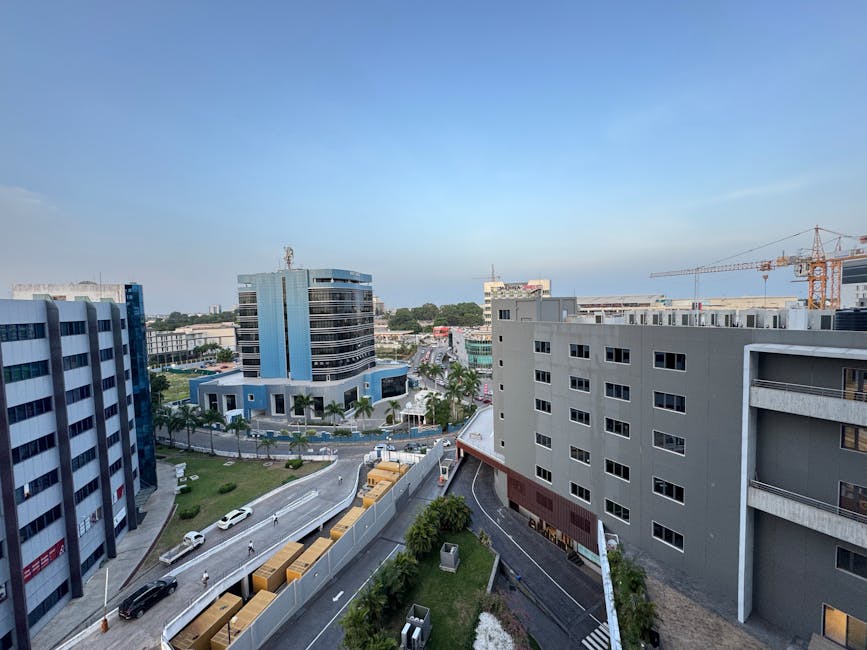 A vibrant cityscape of Accra, showcasing modern architecture and bustling streets.